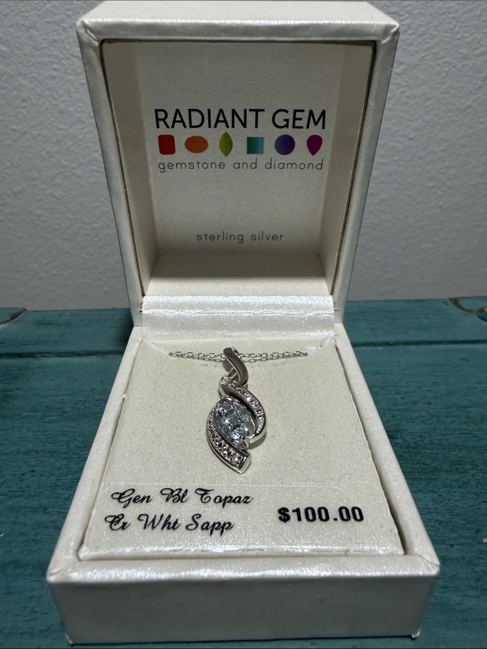 Sterling Silver Blue Topaz Swirl Pendant Necklace